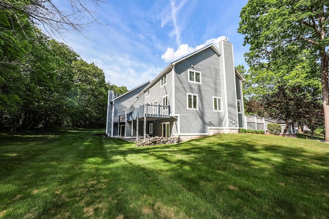 58 Hickory Ln, Windham, NH 03087 - back of house with a chimney, a lawn, and a deck