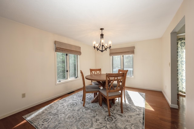 58 Hickory Ln, Windham, NH 03087 - dining space featuring healthy amount of natural light, a chandelier, wood finished floors, and baseboards