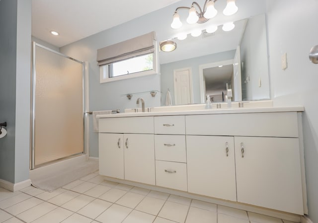 58 Hickory Ln, Windham, NH 03087 - bathroom with double vanity, a stall shower, baseboards, and tile patterned floors