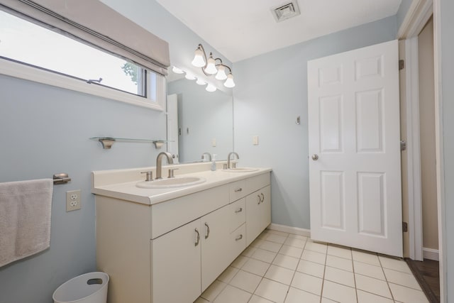 58 Hickory Ln, Windham, NH 03087 - bathroom featuring double vanity, tile patterned flooring, and baseboards
