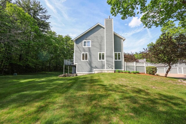 58 Hickory Ln, Windham, NH 03087 - back of house featuring a chimney and a yard