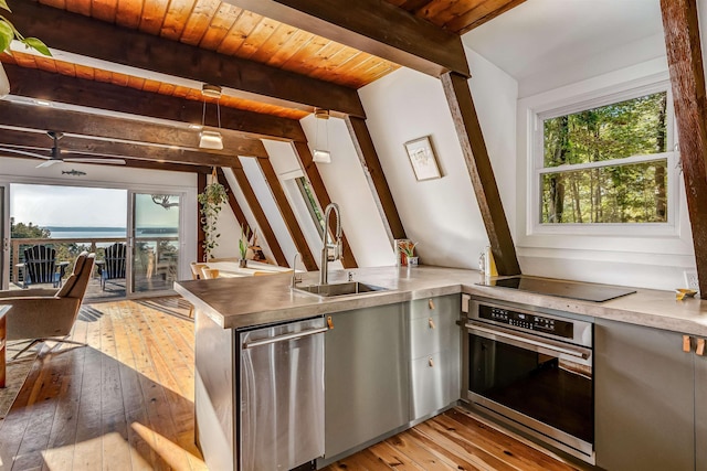 171 Cold Spring Rd, Milton, VT 05478 - kitchen with stainless steel appliances, a sink, light wood finished floors, healthy amount of natural light, and wood ceiling with exposed beams