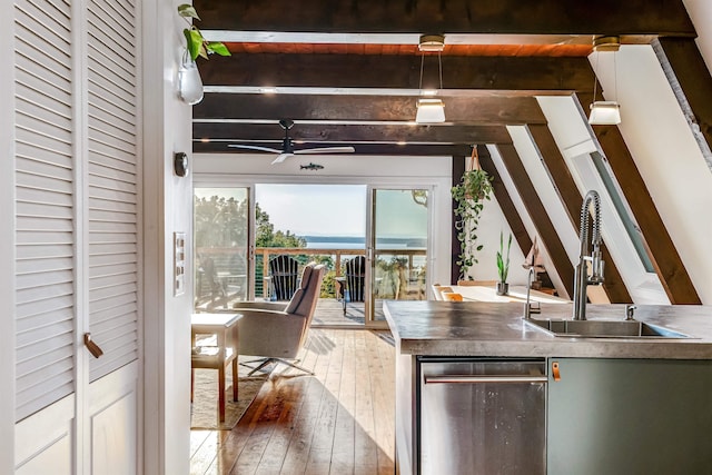 171 Cold Spring Rd, Milton, VT 05478 - kitchen with a sink, wood-type flooring, beam ceiling, a ceiling fan, and stainless steel dishwasher