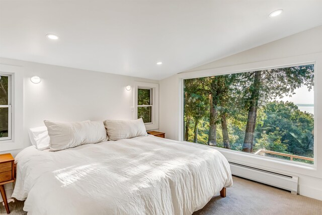 171 Cold Spring Rd, Milton, VT 05478 - carpeted bedroom with a baseboard heating unit, vaulted ceiling, and recessed lighting