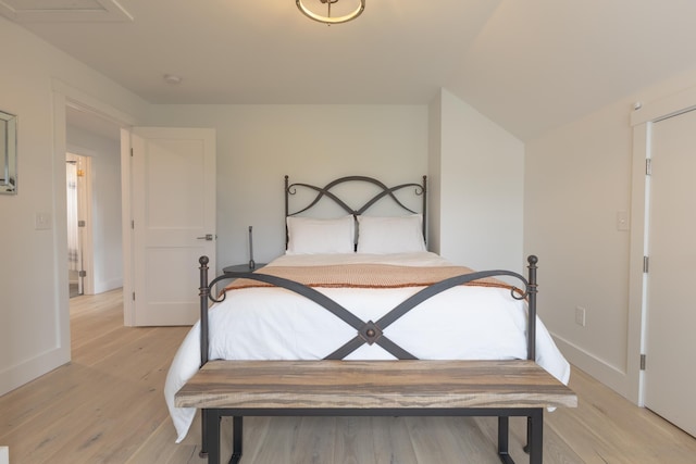 346 Elizabeths Ln Unit 13, Morristown, VT 05661 - bedroom with baseboards and light wood finished floors