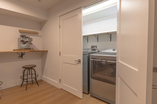 346 Elizabeths Ln Unit 13, Morristown, VT 05661 - washroom featuring washer and dryer and light wood finished floors