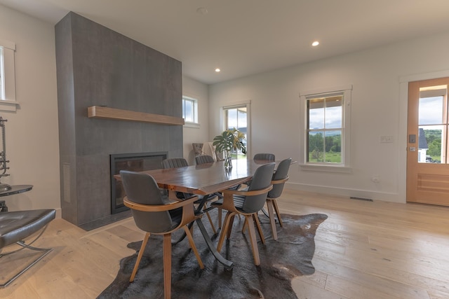 346 Elizabeths Ln Unit 13, Morristown, VT 05661 - dining space with a fireplace, light wood-type flooring, recessed lighting, and baseboards