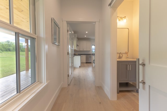 346 Elizabeths Ln Unit 13, Morristown, VT 05661 - corridor featuring light wood-type flooring, recessed lighting, and a sink