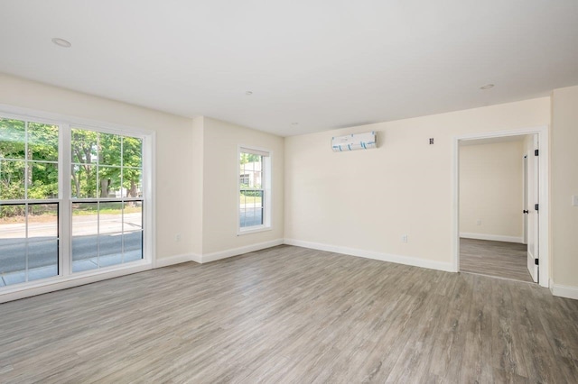 725 Central Ave Unit 103, Dover, NH 03820 - spare room with wood finished floors and baseboards