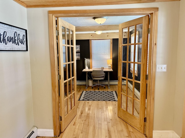 11 Francestown Rd, Bennington, NH 03442 - office area with hardwood / wood-style flooring, a baseboard heating unit, baseboards, and french doors