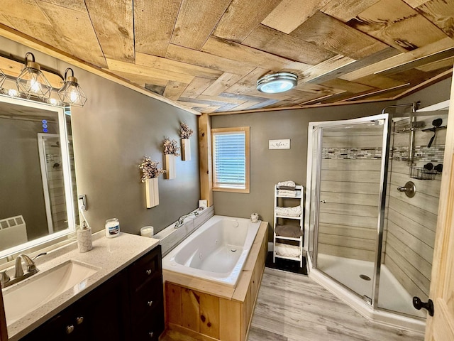 11 Francestown Rd, Bennington, NH 03442 - bathroom with wooden ceiling, vanity, a whirlpool tub, a stall shower, and wood finished floors