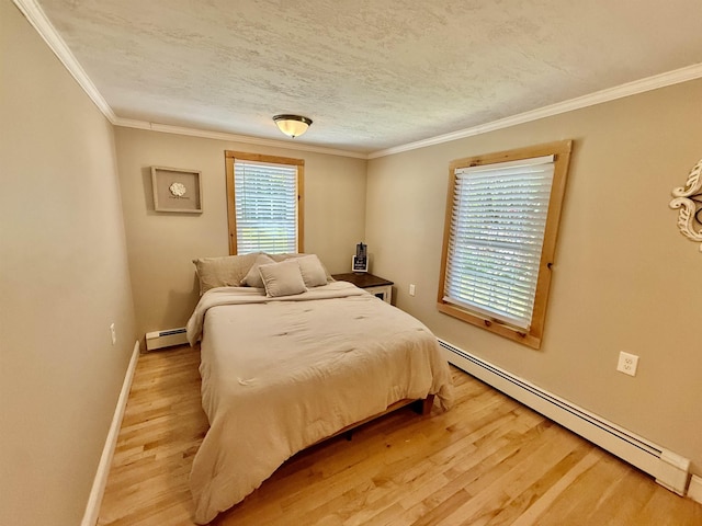 11 Francestown Rd, Bennington, NH 03442 - bedroom with a baseboard radiator, light wood-style floors, ornamental molding, and baseboards