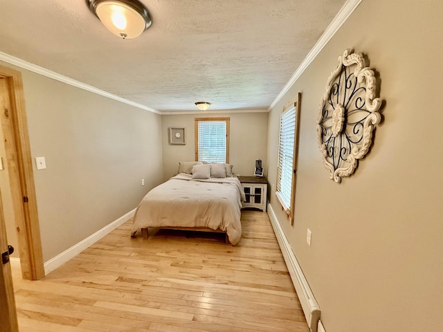 11 Francestown Rd, Bennington, NH 03442 - bedroom featuring light wood-style floors, a textured ceiling, baseboards, crown molding, and baseboard heating