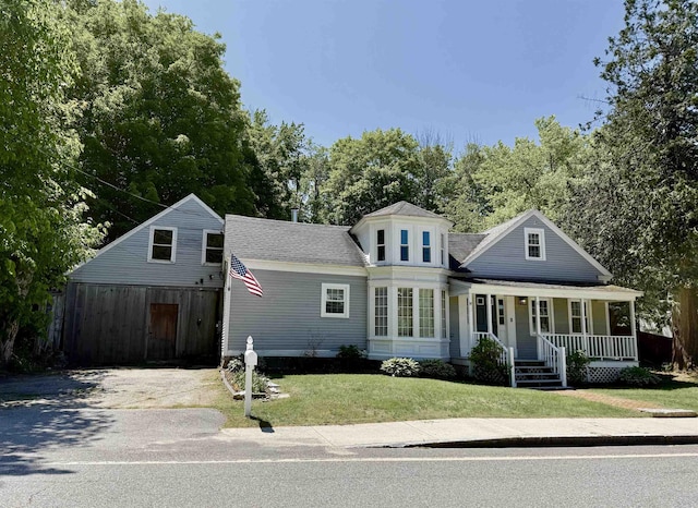 11 Francestown Rd, Bennington, NH 03442 - view of front of house featuring a porch, a front lawn, concrete driveway, and a shingled roof