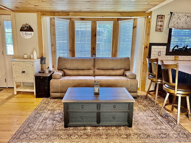11 Francestown Rd, Bennington, NH 03442 - living area with light wood finished floors, wooden ceiling, and ornamental molding