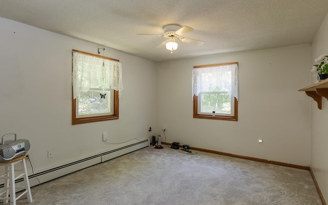 353 N St, Jaffrey, NH 03452 - spare room with a baseboard radiator, carpet, a ceiling fan, a textured ceiling, and baseboards
