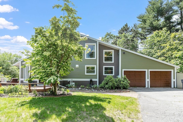 2 Candlewood Rd, Windham, NH 03087 - view of side of property featuring asphalt driveway, a yard, a garage, and a deck