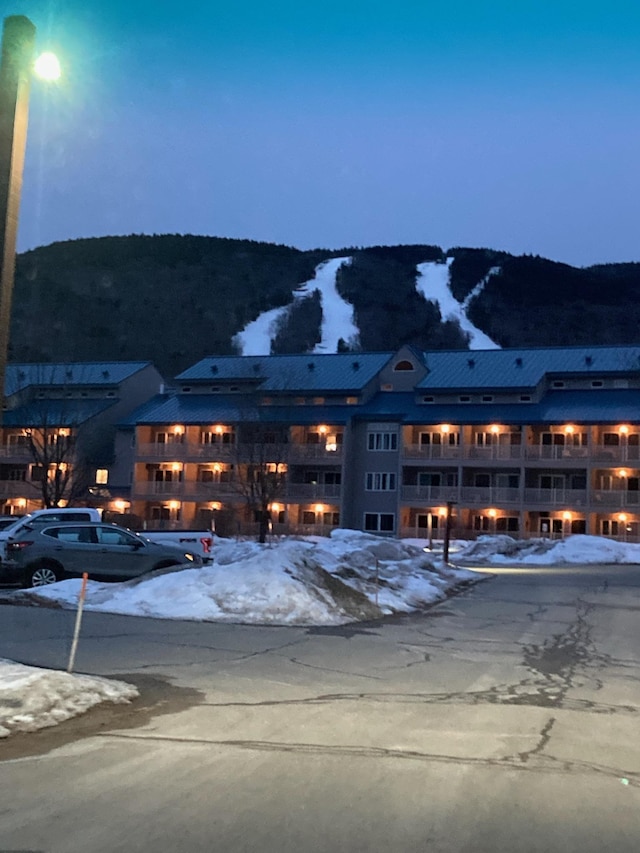 36 Lodge Rd Unit B105, Lincoln, NH 03251 - snow covered building with a fire pit