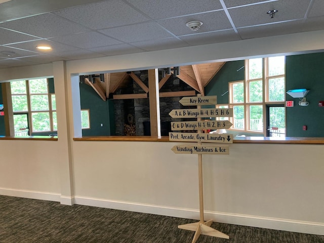 36 Lodge Rd Unit B105, Lincoln, NH 03251 - detailed view of a paneled ceiling, carpet floors, baseboards, recessed lighting, and fire sprinkler in ceiling