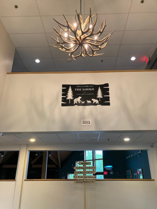 36 Lodge Rd Unit B105, Lincoln, NH 03251 - detailed view of a chandelier, a paneled ceiling, recessed lighting, and a pendent fire sprinkler