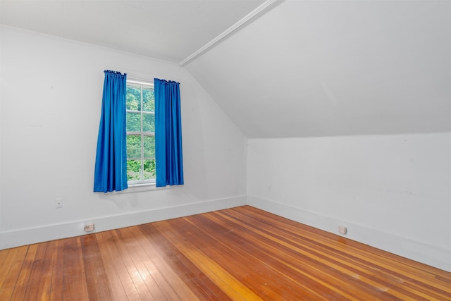 138 Sixth St, Dover, NH 03820 - additional living space with lofted ceiling, baseboards, and hardwood / wood-style flooring