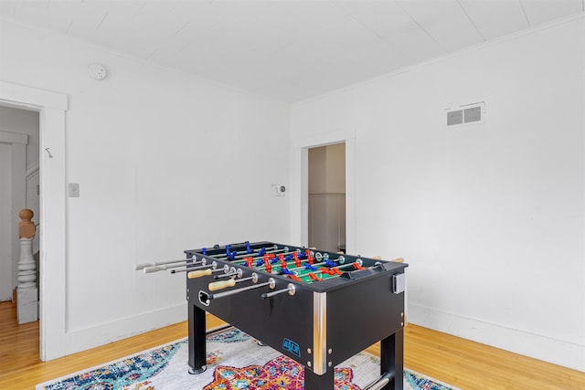 138 Sixth St, Dover, NH 03820 - recreation room featuring wood finished floors, ornamental molding, and baseboards