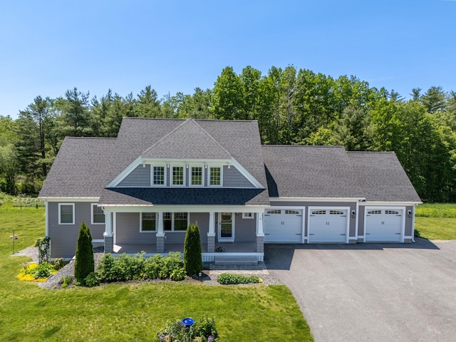 6 Tannery Way, Kensington, NH 03833 - shingle-style home with a garage, covered porch, and a front yard