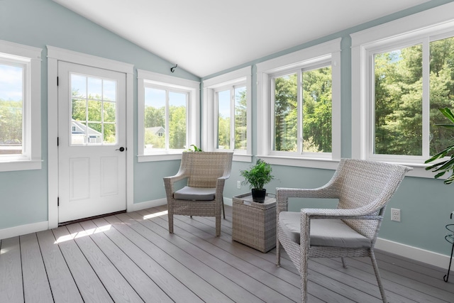 6 Tannery Way, Kensington, NH 03833 - sunroom featuring plenty of natural light, lofted ceiling, wood finished floors, baseboards, and a deck