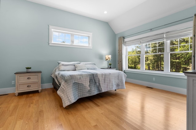 6 Tannery Way, Kensington, NH 03833 - bedroom featuring light wood-type flooring, baseboards, and vaulted ceiling