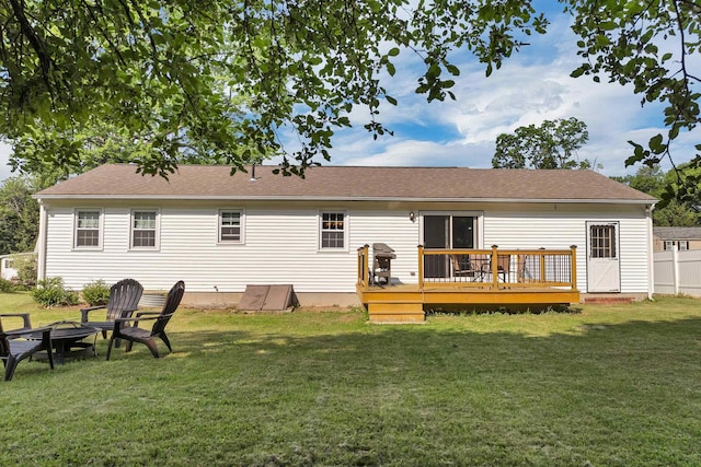 39 Orchard St, Laconia, NH 03246 - rear view of house featuring a deck, a yard, and a fire pit
