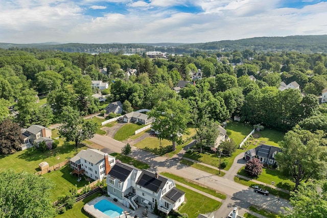 39 Orchard St, Laconia, NH 03246 - drone / aerial view of a pool and a heavily wooded area