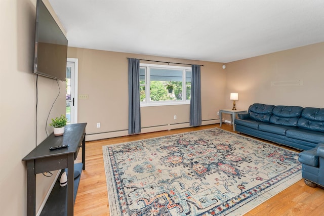 39 Orchard St, Laconia, NH 03246 - living room featuring light wood-style flooring and a baseboard heating unit
