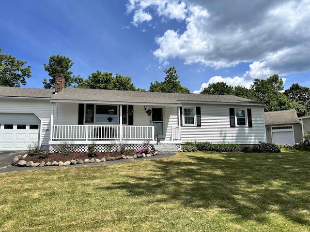 39 Orchard St, Laconia, NH 03246 - single story home with covered porch, a garage, a chimney, and a front yard