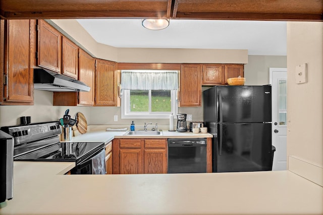 14 Monroe Dr Unit 92, Woodstock, NH 03293 - kitchen featuring black appliances, under cabinet range hood, a sink, light countertops, and brown cabinets
