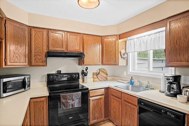 14 Monroe Dr Unit 92, Woodstock, NH 03293 - kitchen featuring black appliances, under cabinet range hood, a sink, and light countertops