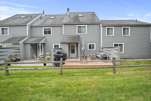 14 Monroe Dr Unit 92, Woodstock, NH 03293 - back of property featuring a shingled roof, a patio, and an outdoor living space