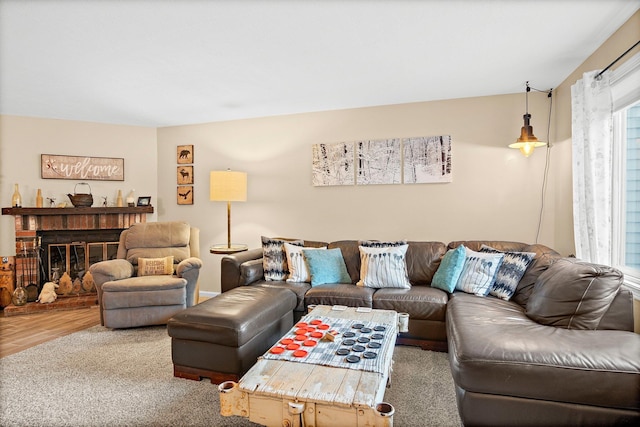 14 Monroe Dr Unit 92, Woodstock, NH 03293 - living room with wood finished floors and a brick fireplace
