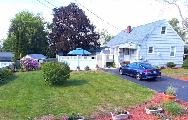 55 Harding St, Manchester, NH 03109 - view of front facade featuring driveway and a chimney