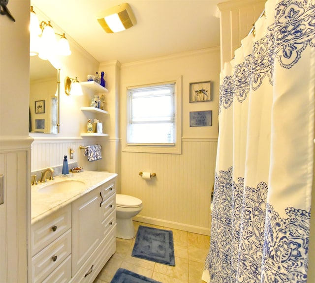 55 Harding St, Manchester, NH 03109 - bathroom with wainscoting, toilet, crown molding, tile patterned flooring, and vanity