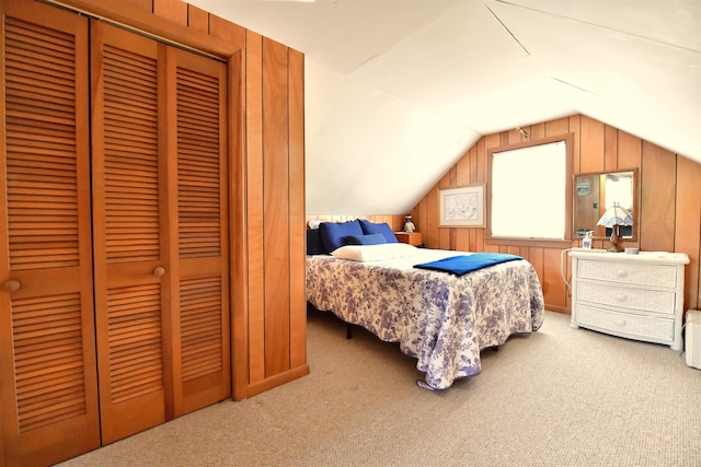 55 Harding St, Manchester, NH 03109 - carpeted bedroom featuring a closet, vaulted ceiling, and wooden walls