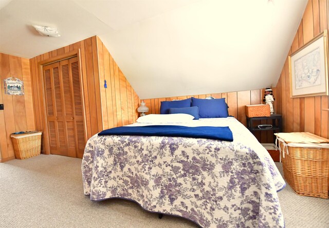 55 Harding St, Manchester, NH 03109 - carpeted bedroom with wood walls, vaulted ceiling, and a closet