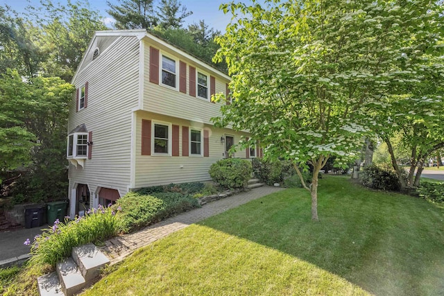 4 Franconia Dr, Nashua, NH 03063 - colonial-style house with a front lawn and a garage