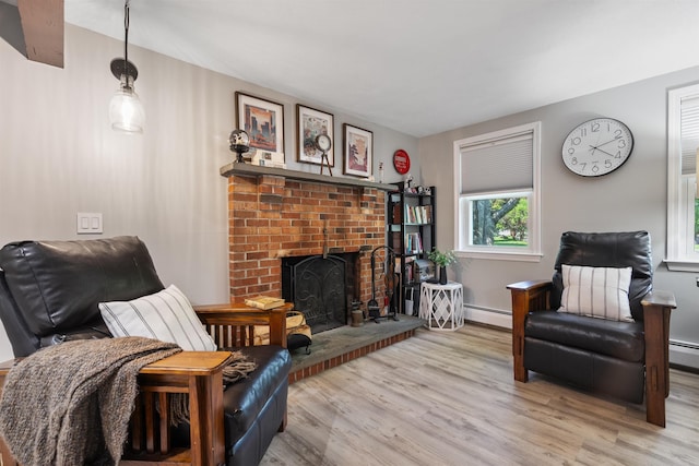 4 Franconia Dr, Nashua, NH 03063 - living area featuring baseboard heating, light wood-type flooring, and a fireplace