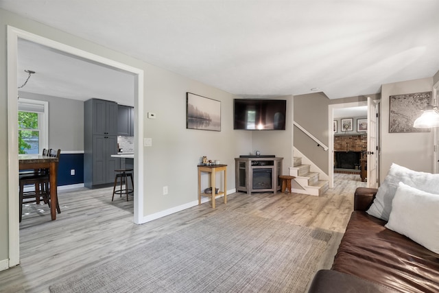 4 Franconia Dr, Nashua, NH 03063 - living area with light wood finished floors, baseboards, and stairs