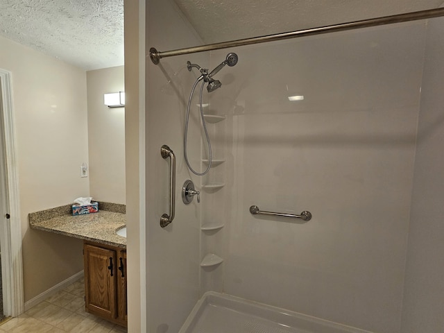302 Eastview Dr, Wilton, NH 03086 - bathroom with a textured ceiling, vanity, and a shower