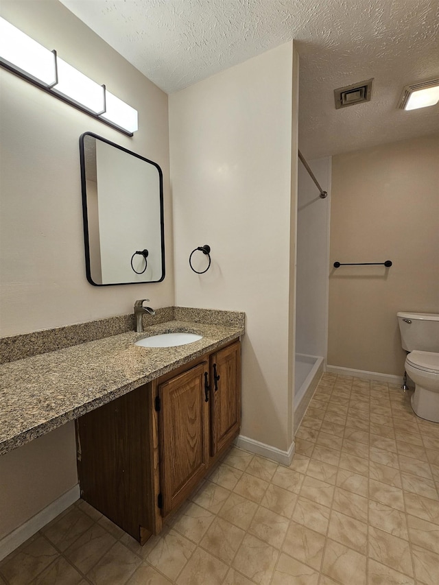302 Eastview Dr, Wilton, NH 03086 - full bath with toilet, a shower, vanity, a textured ceiling, and baseboards