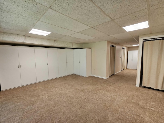 302 Eastview Dr, Wilton, NH 03086 - below grade area with light carpet and a paneled ceiling