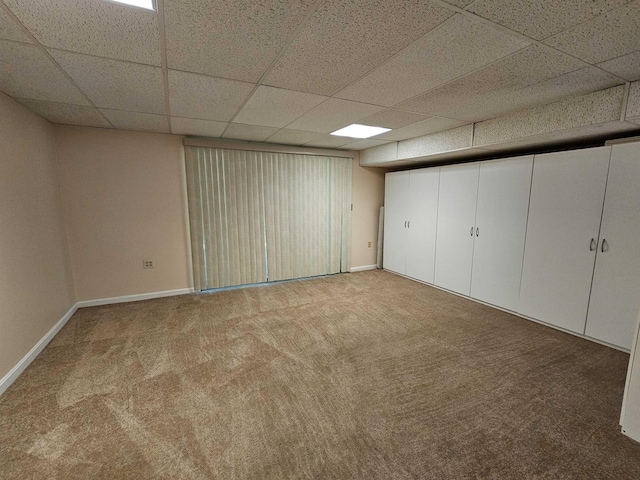 302 Eastview Dr, Wilton, NH 03086 - basement with carpet floors, a drop ceiling, and baseboards