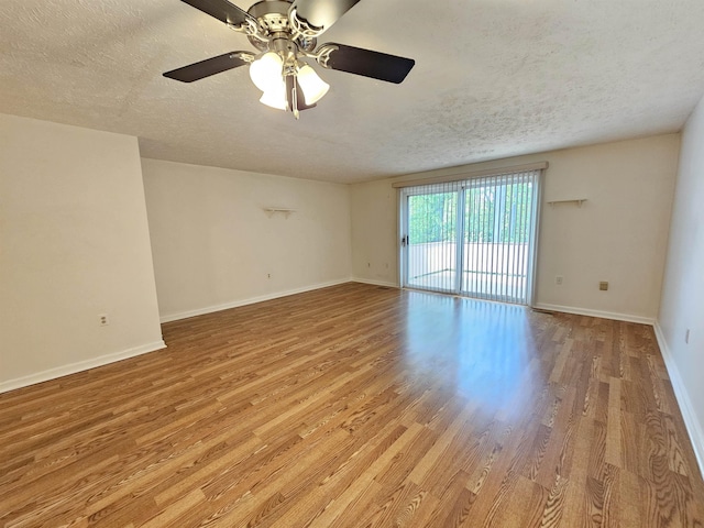 302 Eastview Dr, Wilton, NH 03086 - empty room with light wood-type flooring, a textured ceiling, a ceiling fan, and baseboards