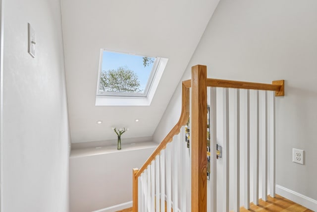 2 Warton Rd, Nashua, NH 03062 - staircase with a skylight, wood finished floors, and baseboards